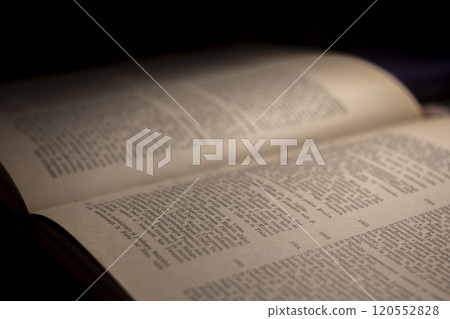 macro photography of a book page with text in Latin font 120552828