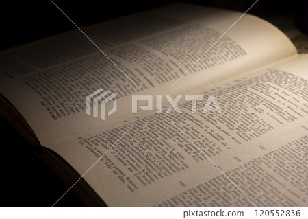 macro photography of a book page with text in Latin font 120552836