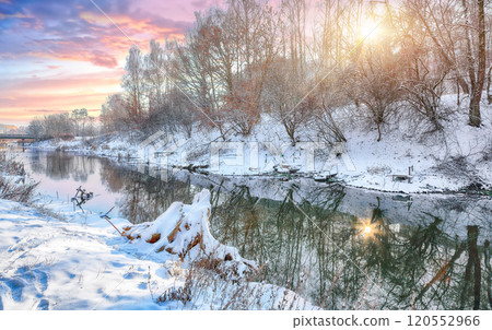 Breathtaking  landscape in city park with snowy trees and beautiful frozen river. 120552966