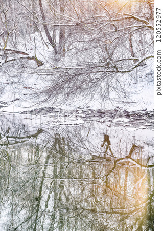 Fabulous landscape in city park with snowy trees and beautiful frozen river. Fabulous landscape in city park with snowy trees and beautiful frozen river. 120552977
