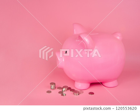 Pink piggy bank ceramic money coins toy on pink background Pink piggy bank ceramic money coins toy on pink background 120553620