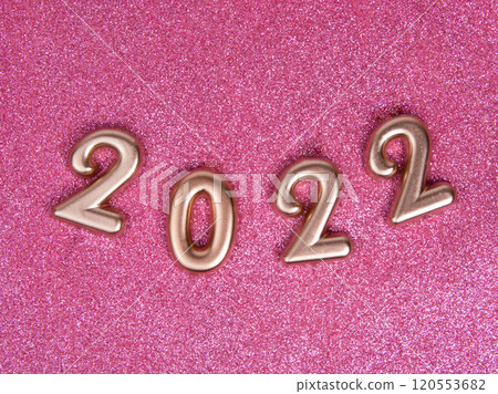 Bronze decorative shiny numbers 2022 new year on pink background with copy space Bronze decorative shiny numbers 2022 new year on pink background with copy space 120553682