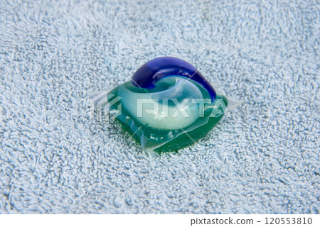 Colorful gel capsule for washing on blue material soft background Colorful gel capsule for washing on blue material soft background 120553810
