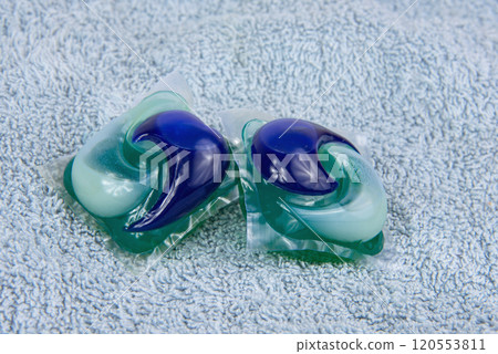 Colorful gel capsule for washing on blue material soft background 120553811