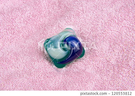 Colorful gel capsule for washing on pink material soft background Colorful gel capsule for washing on pink material soft background 120553812