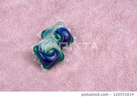 Colorful gel capsule for washing on pink material soft background Colorful gel capsule for washing on pink material soft background 120553814