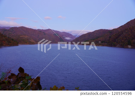 Mountains at sunrise at Tokuyama Dam in late autumn 120554596