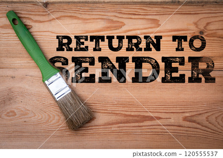 Return to Sender. Text and paint brush on wood texture background 120555537