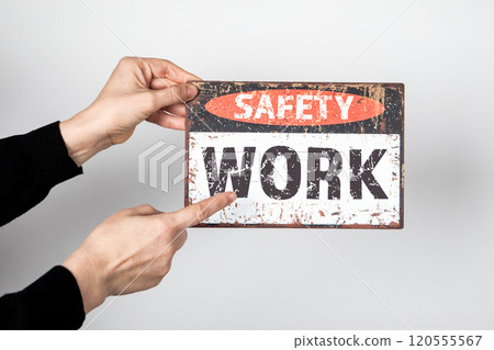 WORK SAFETY Concept. Sign with text in hand on white background 120555567