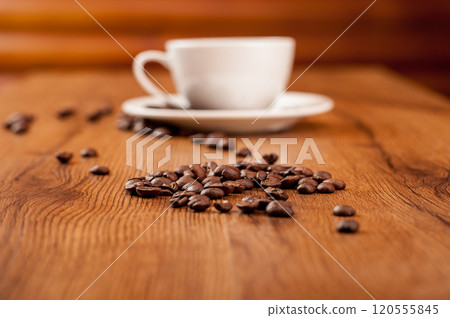 Coffee beans and a cup of coffee.cup of coffee and beans on dark background, top view 120555845
