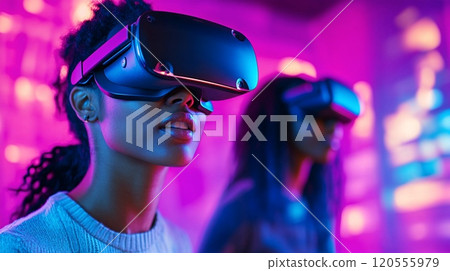 Two Friends Experiencing Virtual Reality in a Futuristic Neon Lit Room Two Friends Experiencing Virtual Reality in a Futuristic Neon Lit Room 120555979