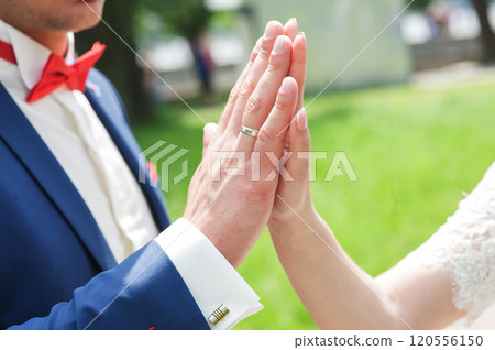 Couple holding hands outdoors feeling.hands close up of a couple in love 120556150