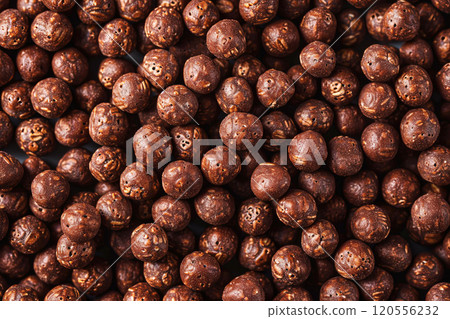 Chocolate breakfast cereal as background. Chocolate cereal balls. Chocolate breakfast cereal as background. Chocolate cereal balls. 120556232