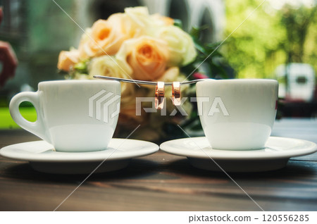 Two cups of coffee on a wooden table Two cups of coffee on a wooden table 120556285
