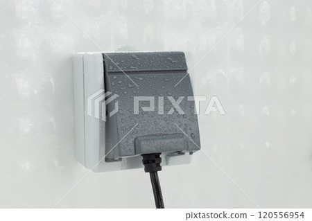 Waterproof Outdoor Electrical Socket with Water Droplets Waterproof Outdoor Electrical Socket with Water Droplets 120556954