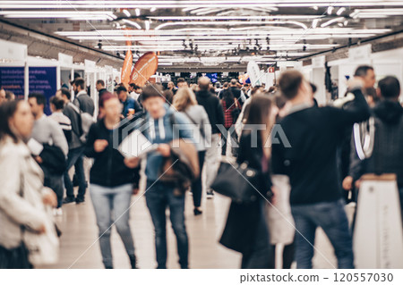 Abstract blurred people at exhibition hall of expo event trade show. Business convention show or job fair. Business concept background 120557030
