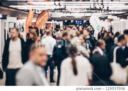 Abstract blurred people at exhibition hall of expo event trade show. Business convention show or job fair. Business concept background Abstract blurred people at exhibition hall of expo event trade show. Business convention show or job fair. Business concept background 120557036