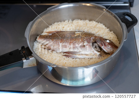 Making sea bream rice in a pressure cooker Making sea bream rice in a pressure cooker 120557727
