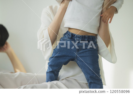 Young family, parents and children, living room Young family, parents and children, living room 120558096