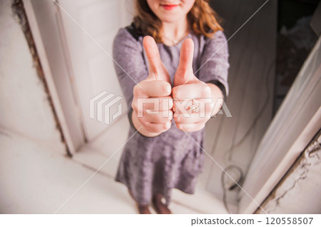 Hands of young people in the indoor, team concept.girls pointing their fingers up the hill showing ok Hands of young people in the indoor, team concept.girls pointing their fingers up the hill showing ok 120558507