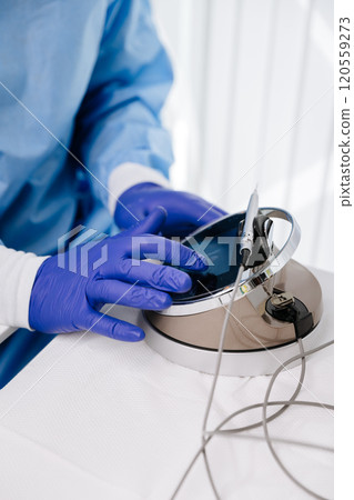 Dentist using advanced touch screen equipment for dental treatment with precision tools Dentist using advanced touch screen equipment for dental treatment with precision tools 120559273