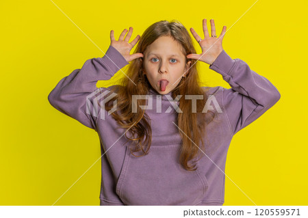 Cheerful funny bully child girl showing tongue making silly faces, fooling around, joking, teasing Cheerful funny bully child girl showing tongue making silly faces, fooling around, joking, teasing 120559571