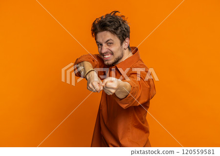Mime Caucasian man pulling an imaginary unreal invisible rope puts lot of effort success promotion 120559581