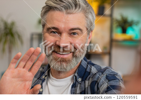 POV portrait of happy senior man chatting with friend or relative on video call on smartphone 120559591