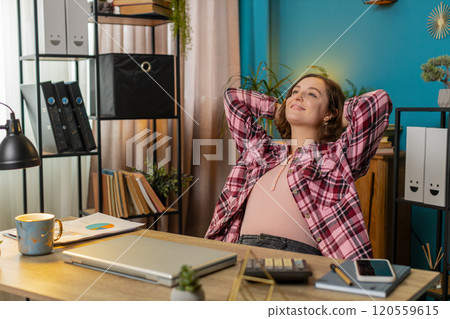 Business woman freelancer closing laptop taking break leaning on chair relaxing after working 120559615