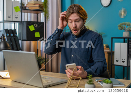 Business man using smartphone bad news lottery game results fortune loss fail at home office Business man using smartphone bad news lottery game results fortune loss fail at home office 120559618