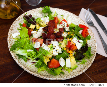 Catalonian salad with sausages, avocado and cheese 120561871