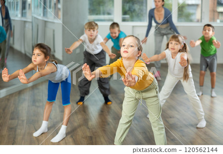 Group of children warming up before dance class Group of children warming up before dance class 120562144