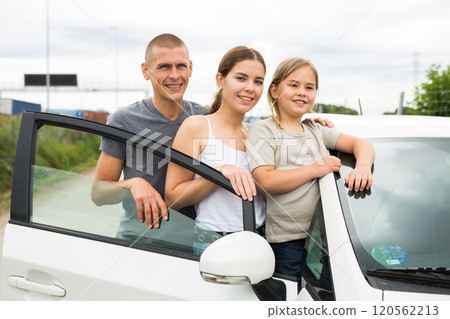 Portrait of happy family near their new car 120562213