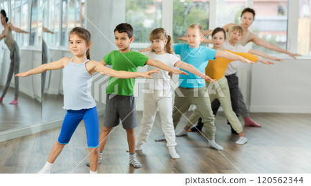 Group of children warming up before dance class Group of children warming up before dance class 120562344