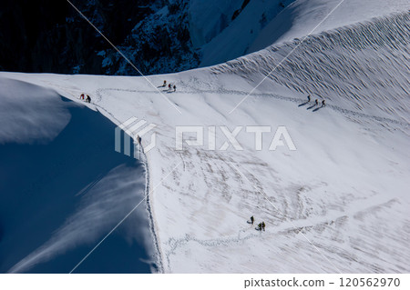 Spectacular view from Aiguille du Midi observation deck, alpinists, Chamonix, France Spectacular view from Aiguille du Midi observation deck, alpinists, Chamonix, France 120562970