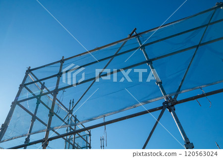 Mesh protective sheet at a demolition site Mesh protective sheet at a demolition site 120563024