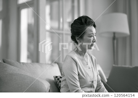 black and white portrait of a sad asian elderly woman 120564154