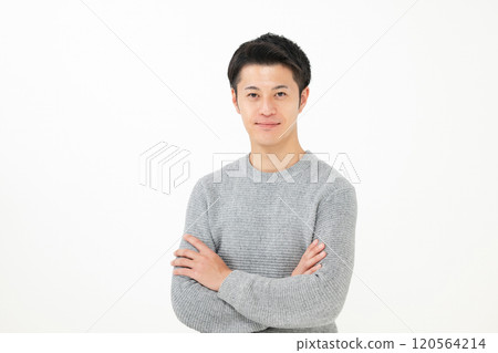 A man with his arms folded A man with his arms folded 120564214