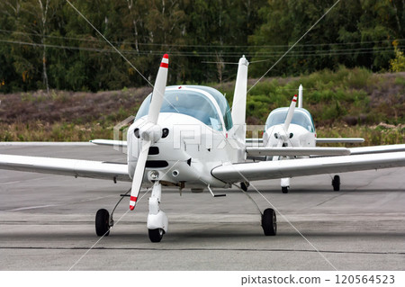 Small sports aircraft in the parking lot of the airfield Small sports aircraft in the parking lot of the airfield 120564523