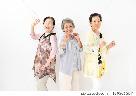 Senior woman smiling dancing 120565597