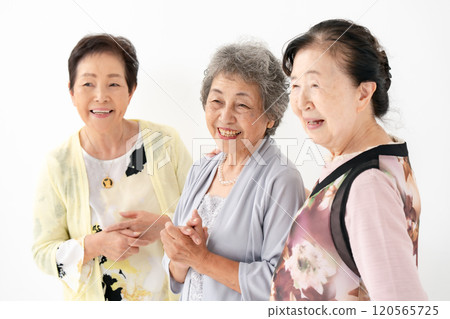 Senior women chatting friends Senior women chatting friends 120565725