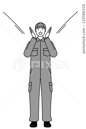 一名身穿連身褲的機械師用手摀住嘴，向人們喊話。 120566328