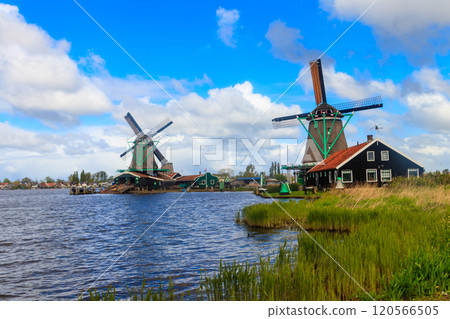Traditional dutch windmills at the Zaan river in Zaanse Schans village, Netherlands Traditional dutch windmills at the Zaan river in Zaanse Schans village, Netherlands 120566505