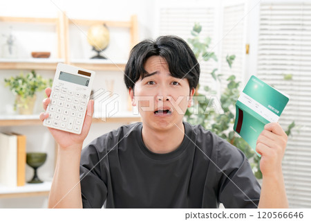 A worried man holding a bankbook A worried man holding a bankbook 120566646