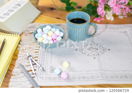 Colorful Ramune and coffee prepared on a table with study materials 120566729