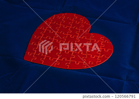 Feelings concept. Heart puzzle on blue background 120566791