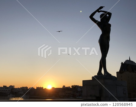 Posed Goddess Statue and Sunrise 120568945
