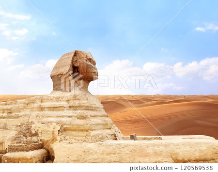 Famous Great Sphinx and sand dunes, Cairo, Egypt. Statue of Sphinx, mythical creature with head of man and body of lion, Giza complex (Giza Necropolis) 120569538