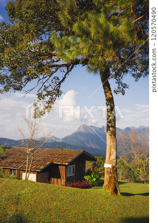 landscape and travel concept with sunlight and cloudy sky with country house on mountain landscape and travel concept with sunlight and cloudy sky with country house on mountain 120570490