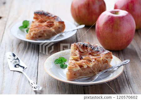 Apple pie (cut image) on old wooden background Apple pie (cut image) on old wooden background 120570602